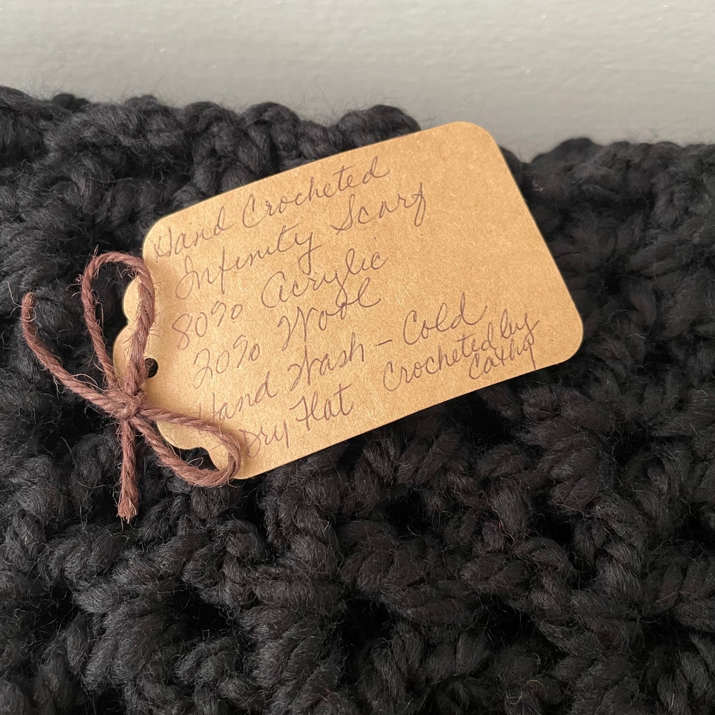 tag closeup--80% acrylic/20% wool, hand wash cold, dry flat, crocheted by Catny