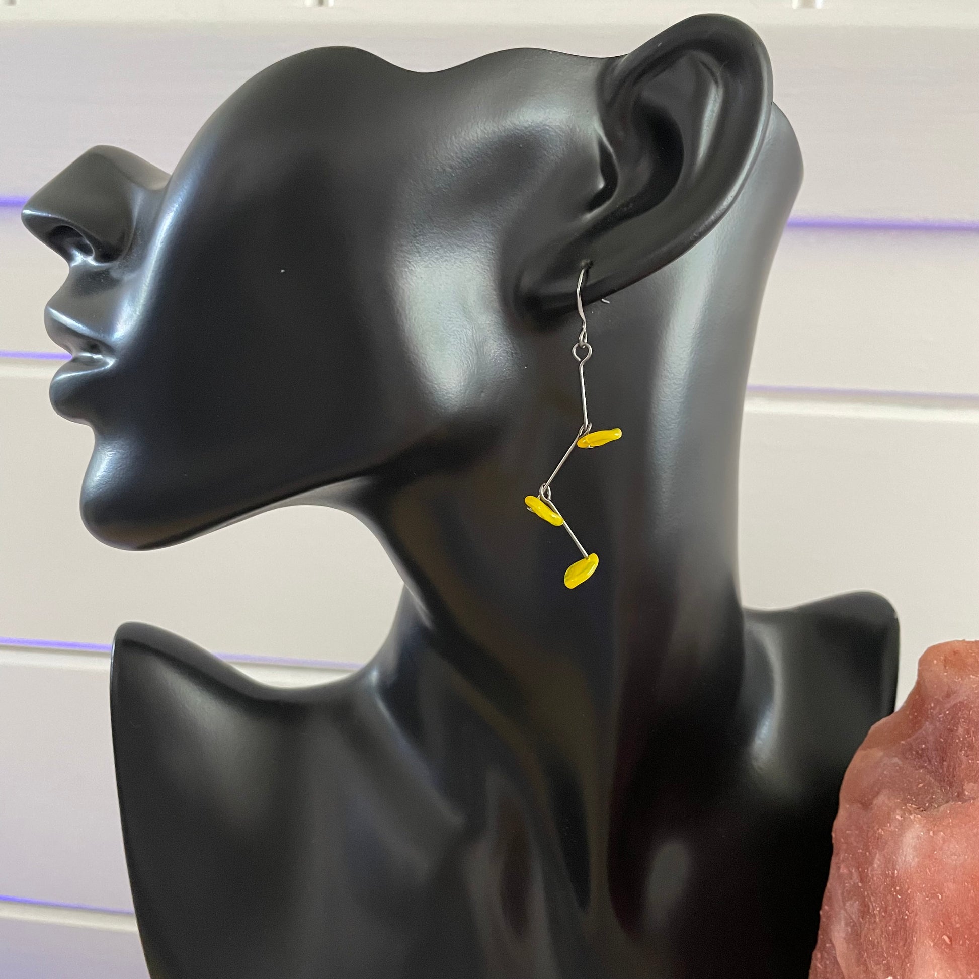 single earring displayed on black background
