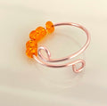 Single Adjustable Fidget Ring in Rose Copper/Translucent Orange Bead Anti Anxiety Stress Spinner Wire