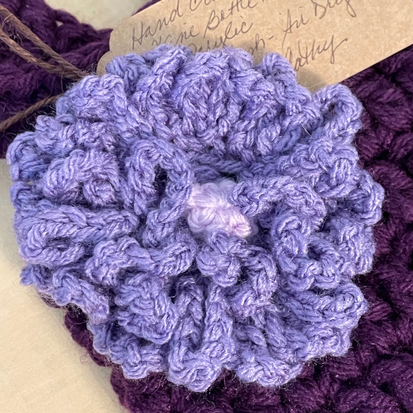 closeup of crocheted lilac flower