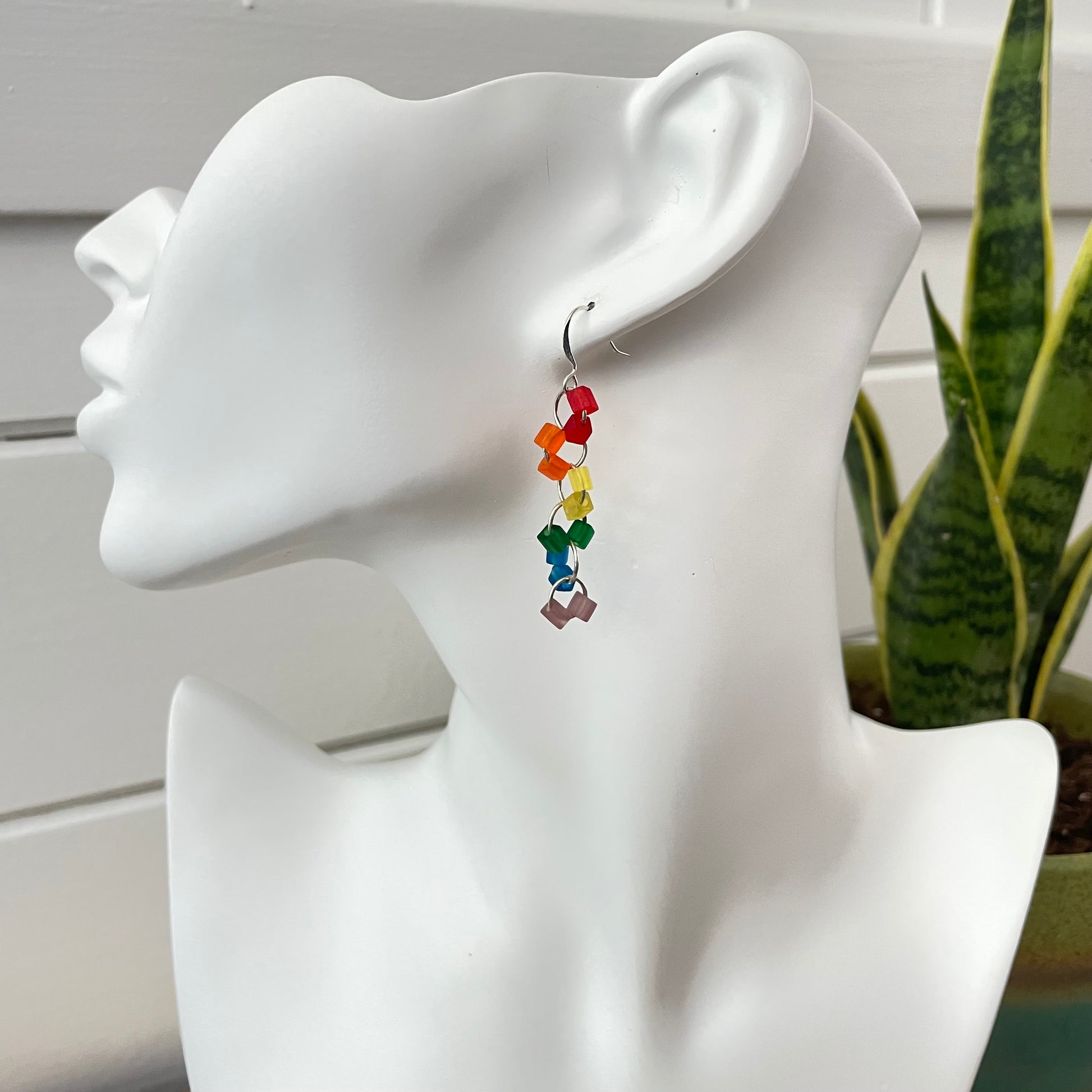 Rainbow Frosted Glass Geometric Link Dangle Earrings 2" LGBTIA Hand Crafted Colorful Ally Pride Flag--view of single earring displayed on solid white mannequin