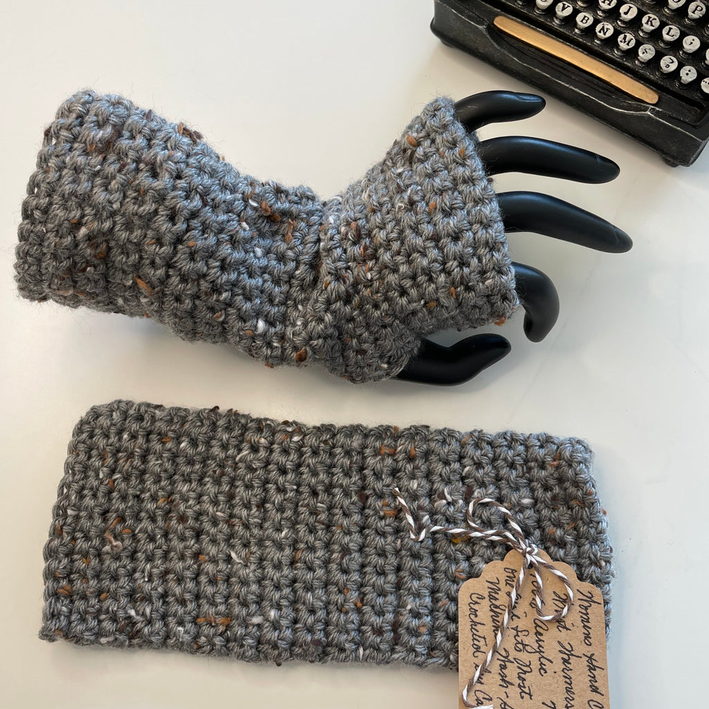 gloves displayed--one flat, one on mannequin hand