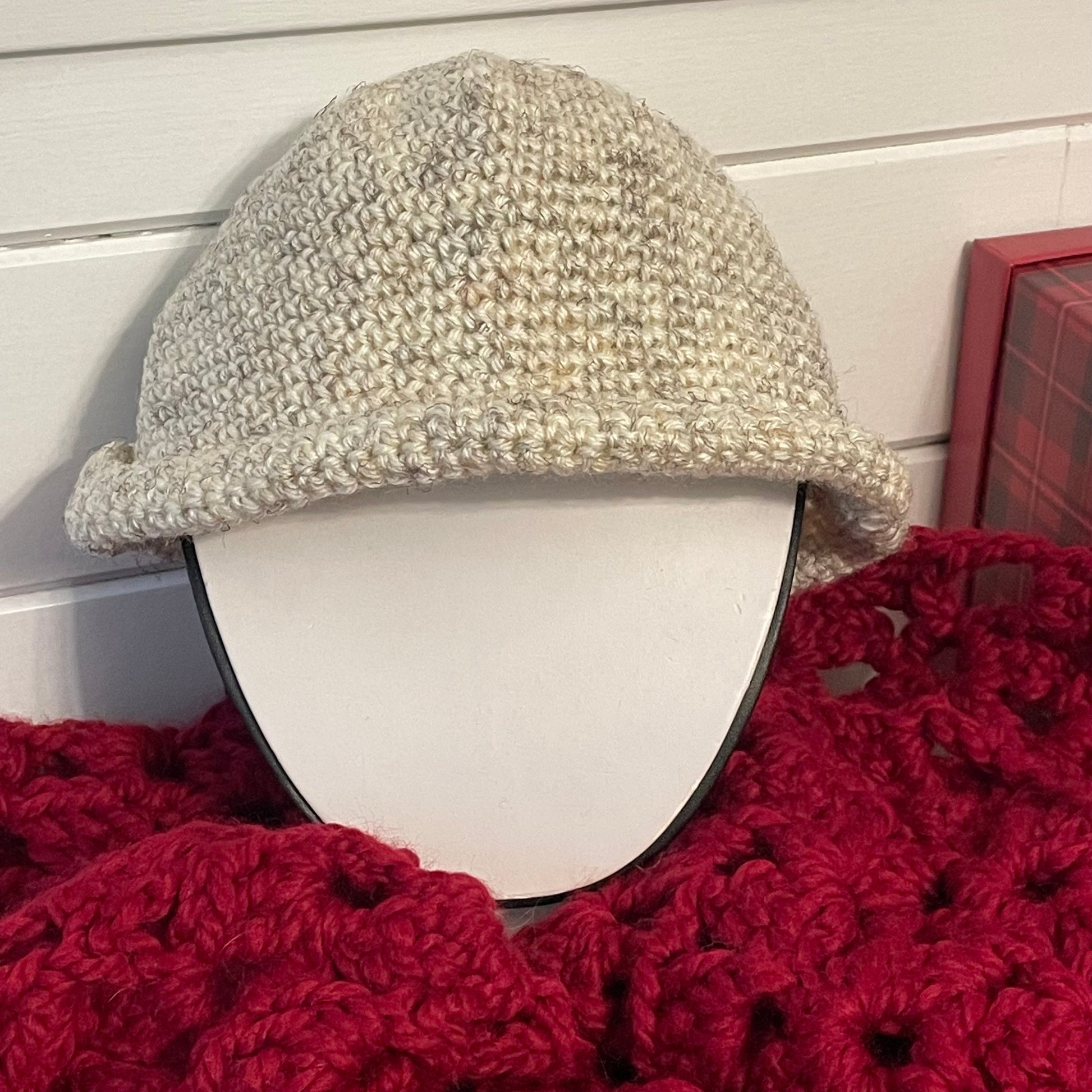 Crochet Rolled Brim Hat in Light Marbled Wheat Hand Crafted Knit Unisex Vintage Retro Style Outdoor front view on red and white background