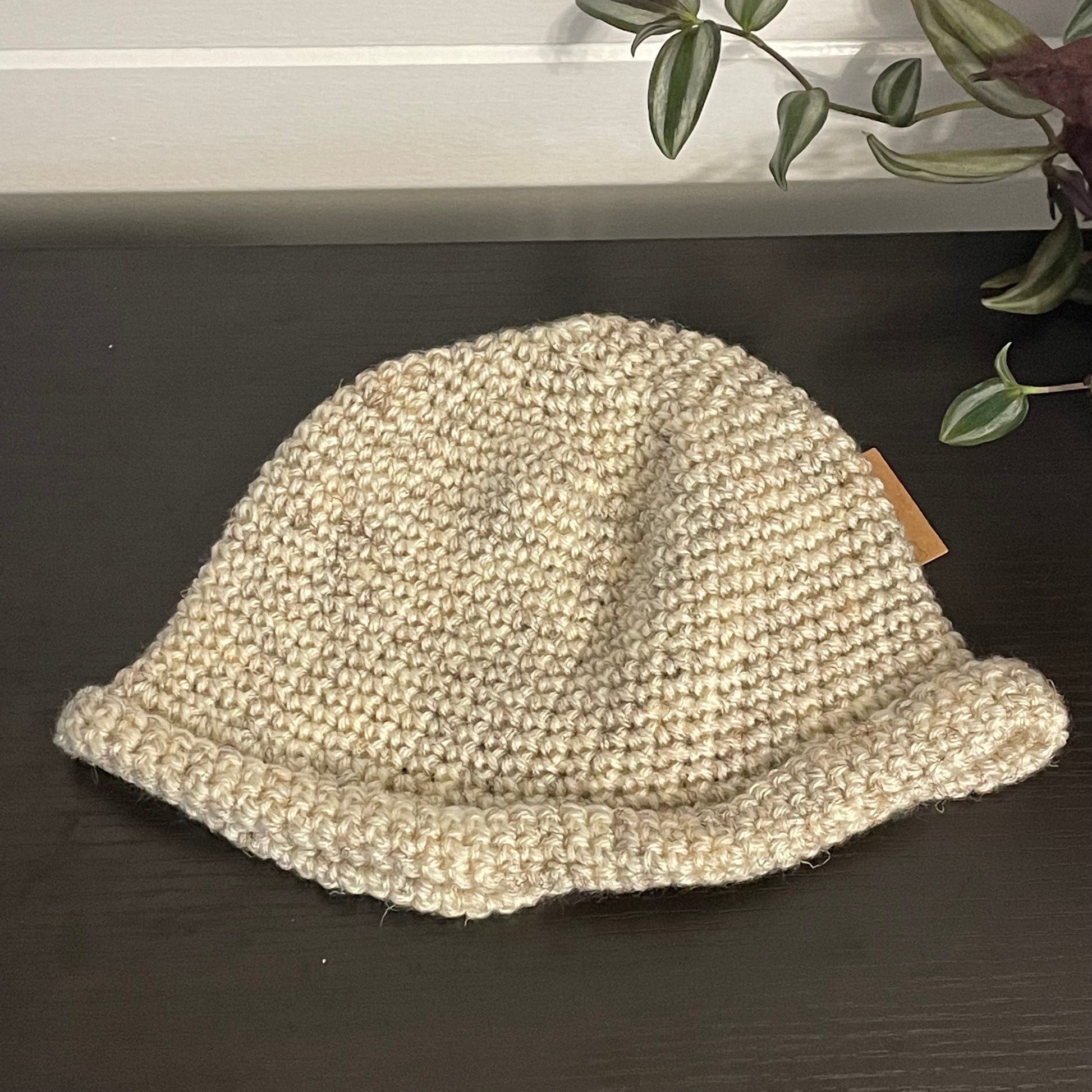 view of hat laying flat on black table
