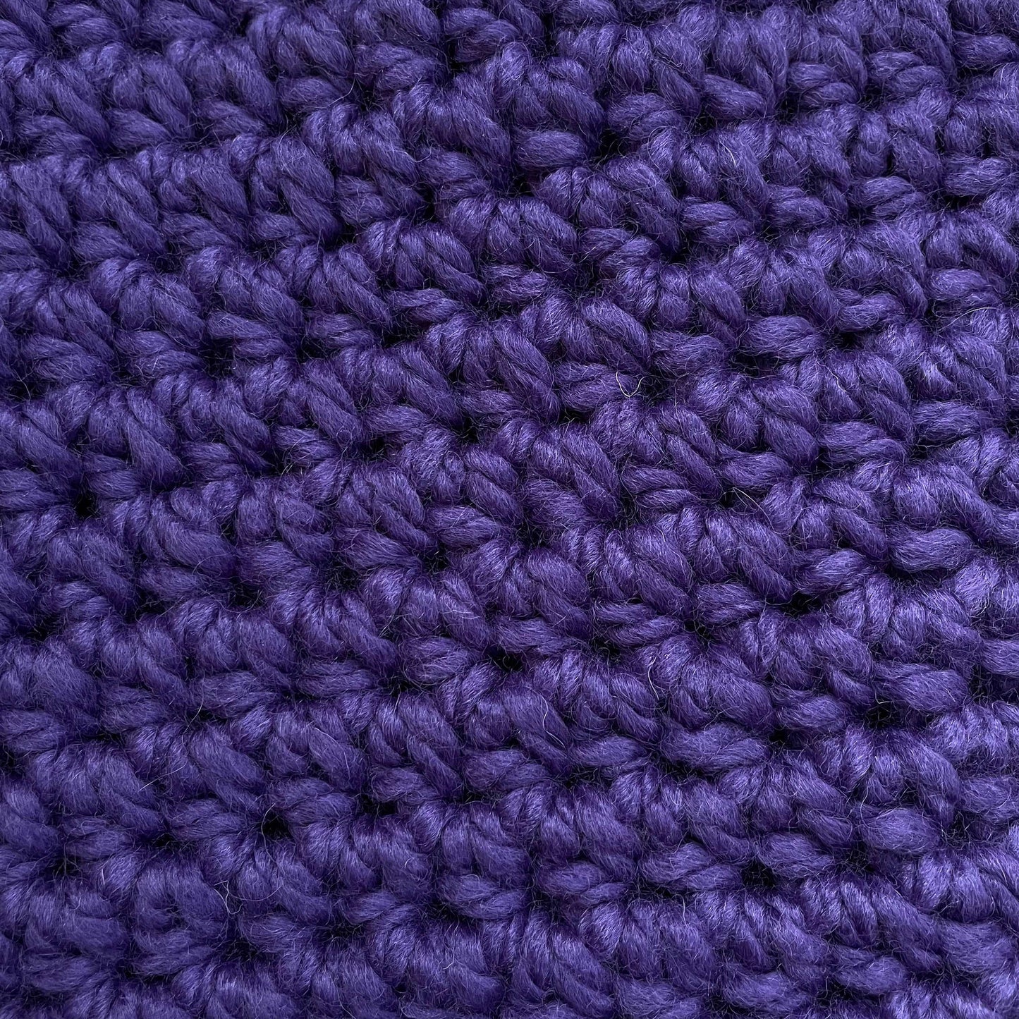 close up of purple yarn for color & stitch