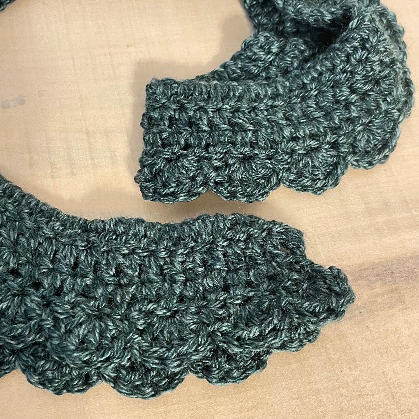 close up view of scalloped edges, ends and yarn