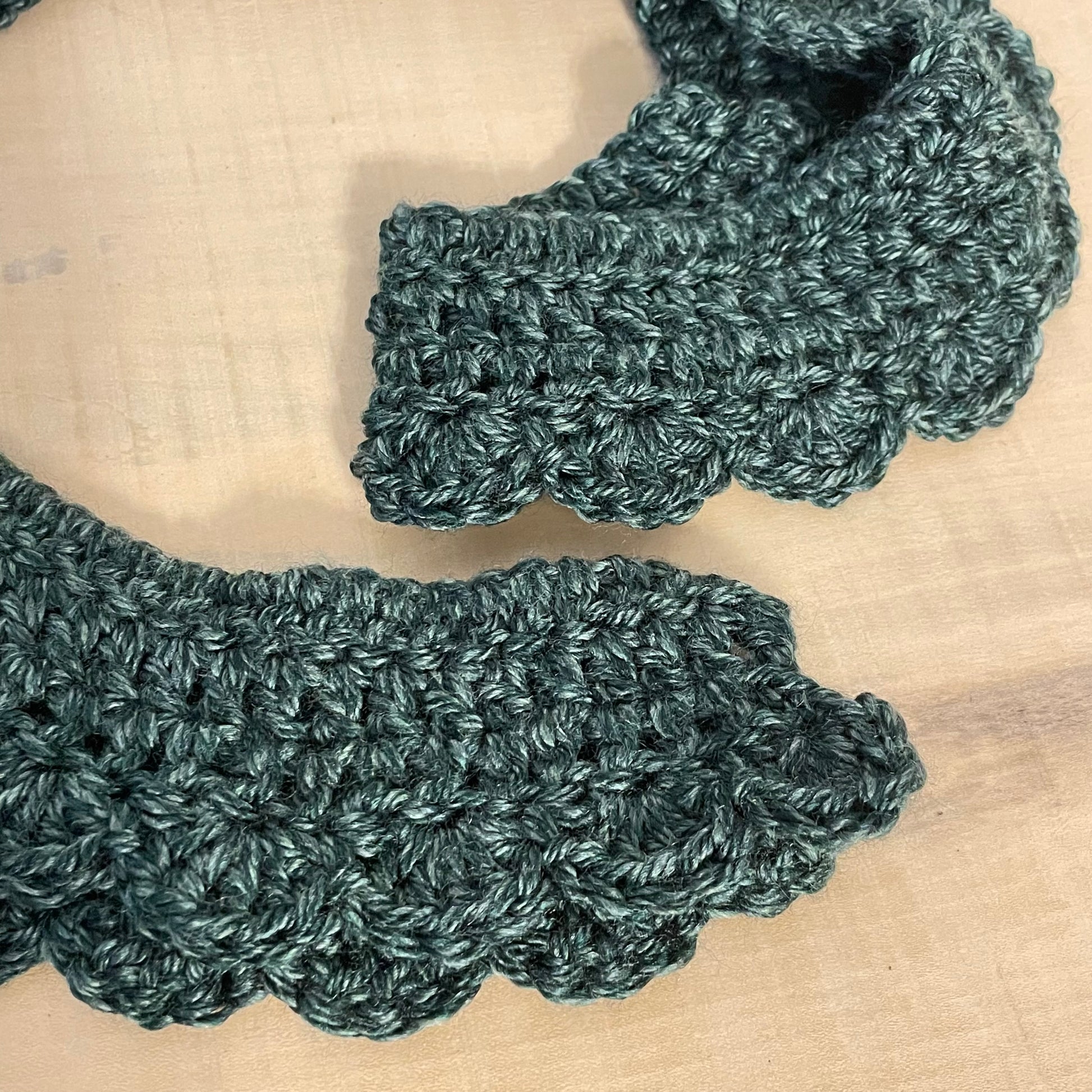 close up view of scalloped edges, ends and yarn