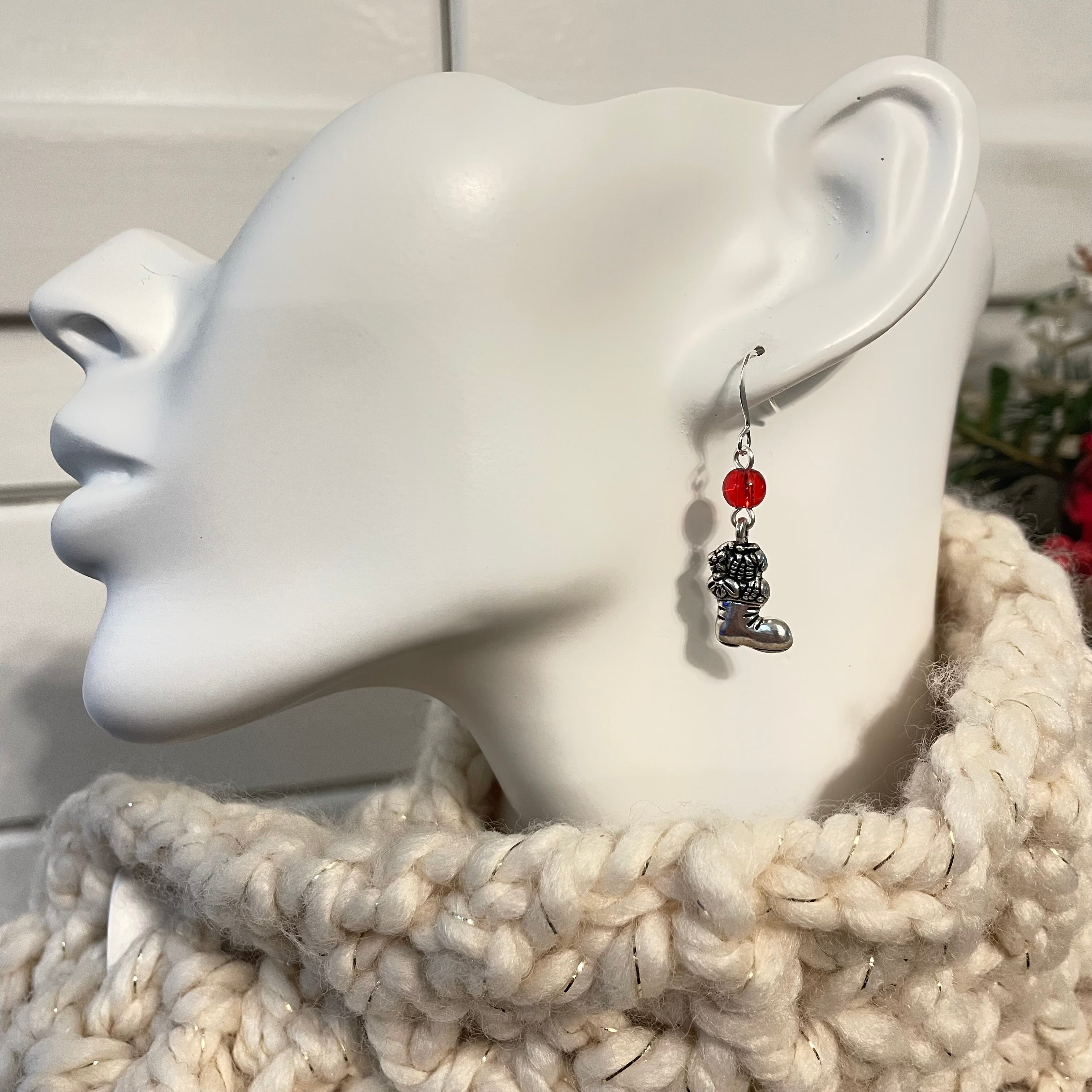 single earring displayed on mannequin
