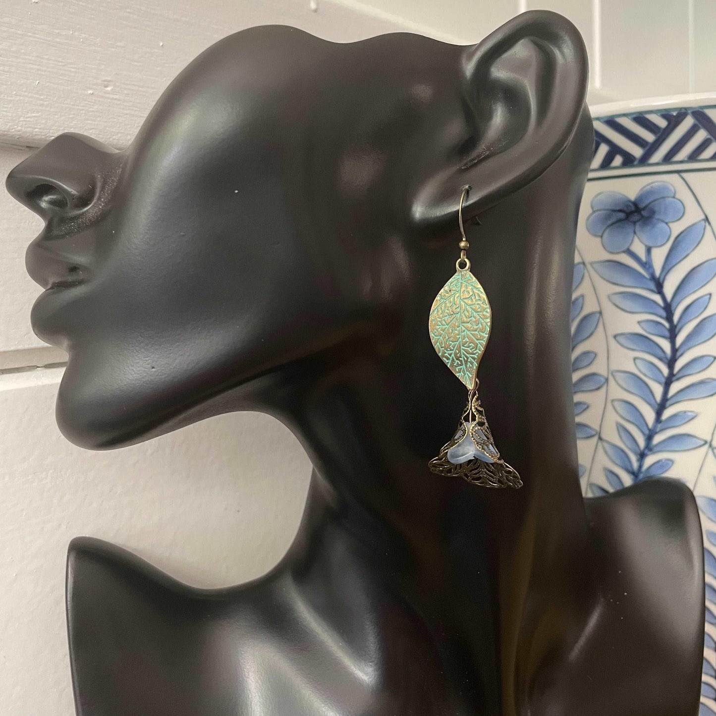displayed on a solid black mannequin head