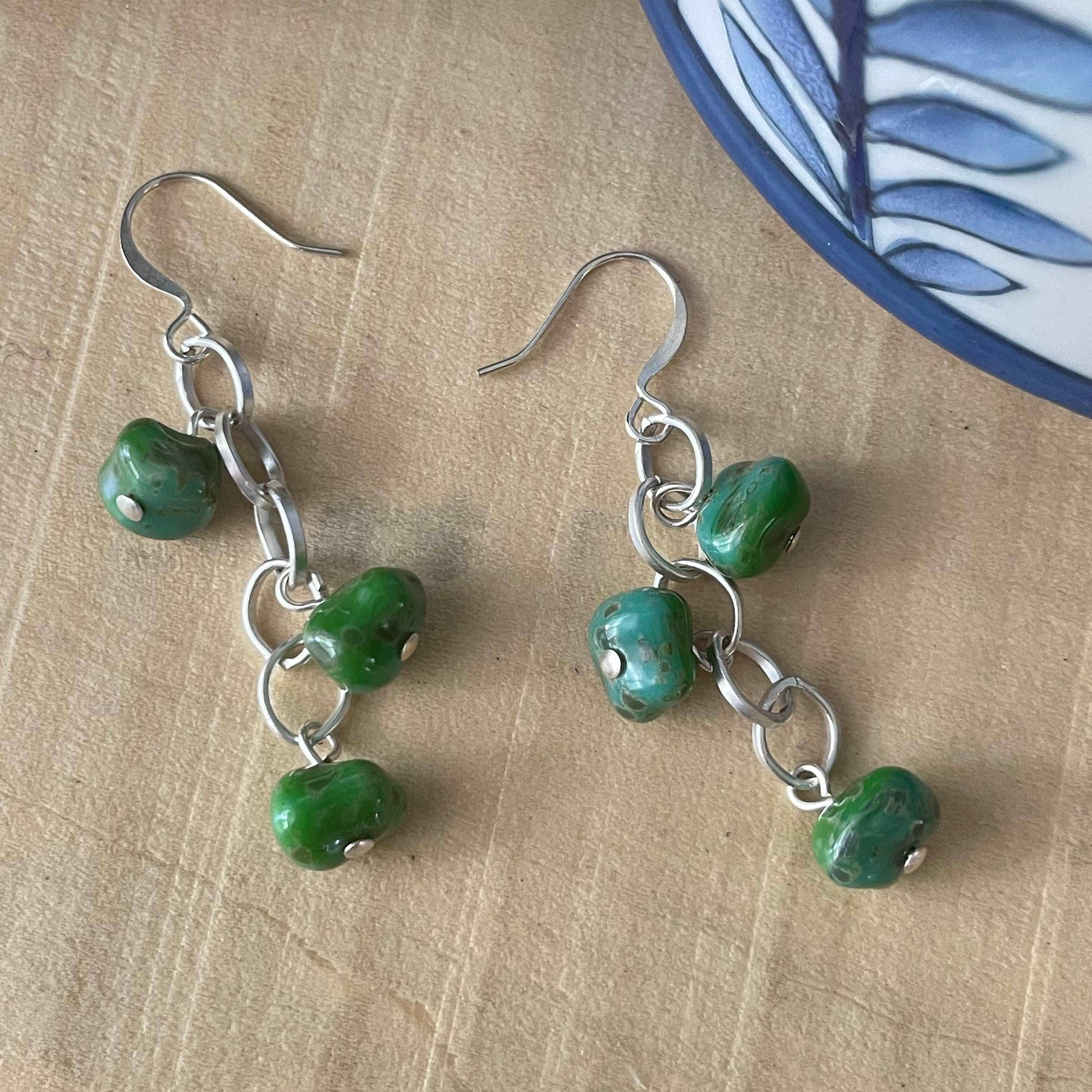 Abstract Green Glass Bead & Matte Chain Dangle Earrings 2" Spring Summer--displayed on a light tan background