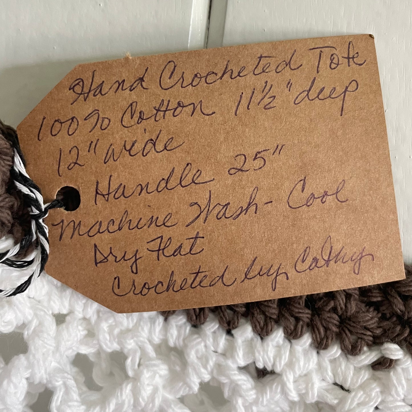 close up of handwritten tag--details in product description